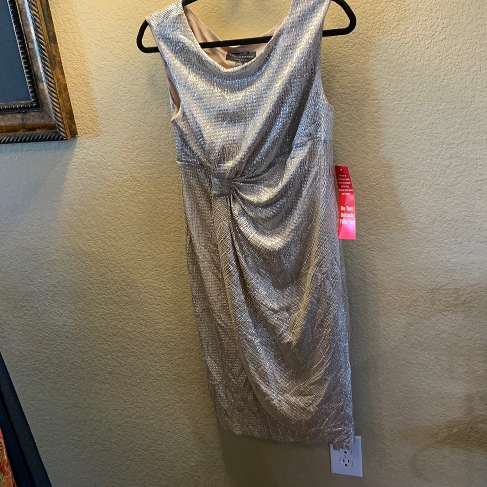 Champagne shimmery cocktail dress never worn . Lightweight and lined